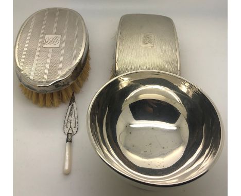 Two silver backed gentlemens hairbrushes with engine turned decoration, hallmarked silver sugar bowl. 75.4gms and a silver mo