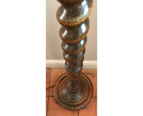 An oak barley twist standard lamp. 145cms h. 