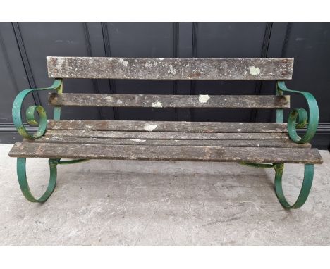 An old green painted wrought iron garden bench,&nbsp;150cm wide.&nbsp; 
