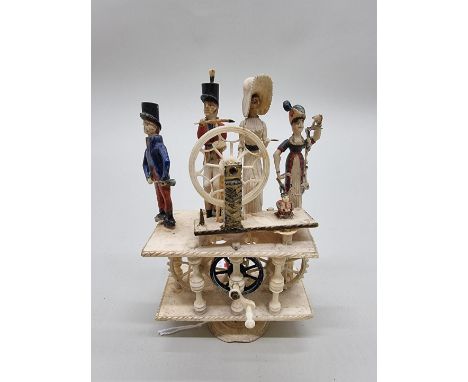 A rare early 19th century Napoleonic Prisoner of War Spinning Jenny automaton bone figure group,&nbsp;14cm high. Provenance: 