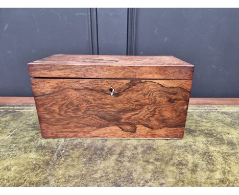 An early 19th century rosewood tea caddy, the interior with original glass mixing bowl, 31cm wide 