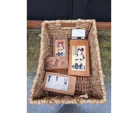 Three old wood chess sets; and together with two playing card packs.&nbsp; 