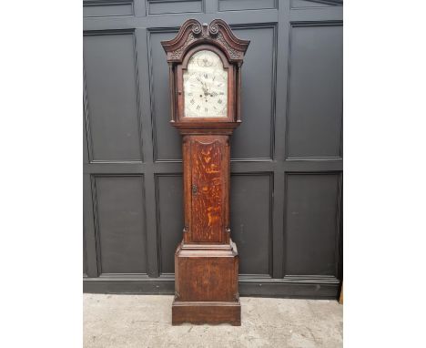 A George III oak and mahogany crossbanded eight day longcase clock, the 13in painted arched dial inscribed 'Tos Brown, Birmin