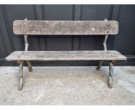 A Victorian cast iron bench,&nbsp;with naturalistic branch form supports, 152.5cm wide.&nbsp; 