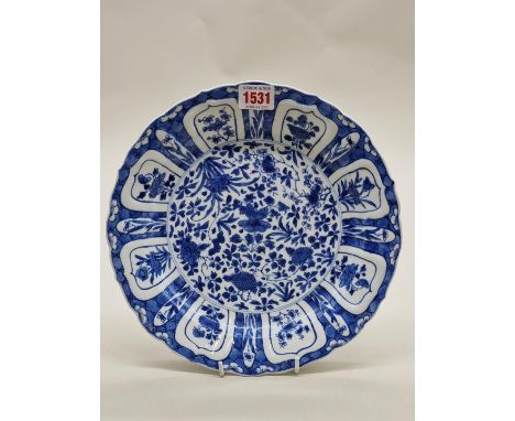A Chinese blue and white dish,&nbsp;Kangxi, 'Qi Yu Bao Ding Zhi Zhen' six character mark to base, 26cm diameter, (cracked). 