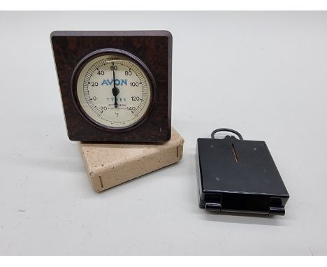 A brown Bakelite 'Avon Tyres' barometer; together with a military compass. (2) 