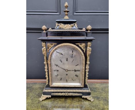 A large late 19th century ebonized and brass bracket type triple fusee clock,&nbsp;with silvered dial, striking on eight bell