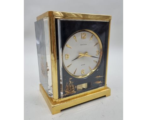 A Jaeger-LeCoultre Atmos 'Marina' brass and perspex clock,&nbsp;23cm high, (damage to perspex). 