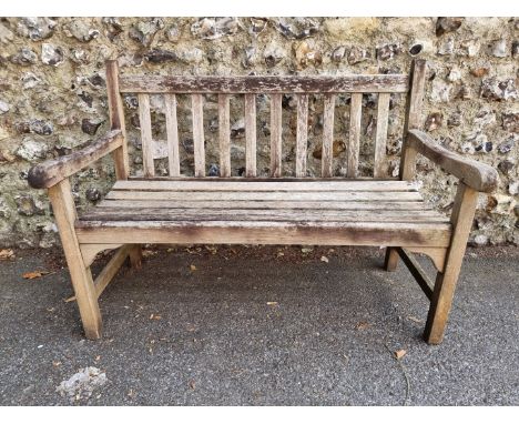 A teak garden bench, 122cm wide. 