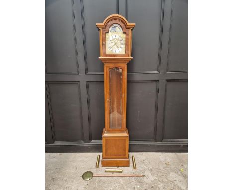 A small reproduction yew longcase clock, with moonphase arch, chiming on eight straight gongs, 195cm high, with pendulum and 