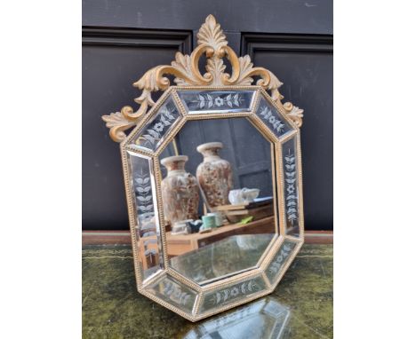 A reproduction Venetian style easel back mirror, 43.5cm high.&nbsp; 