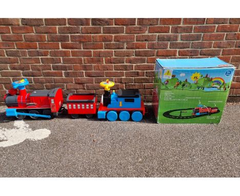 A Chad Valley child's ride-on electric train set,&nbsp;boxed; together with a Thomas &amp; Friends ride-on train. 