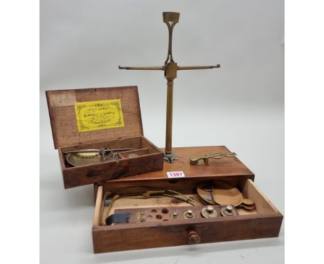 A 19th century oak cased set of balance scales,&nbsp;labelled W &amp; T Avery, with weights; together with another mahogany b