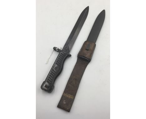 A Yugoslavian M1956 knife bayonet for the 9mm M1956 submachine gun. With moulded plastic grips with integrated sliding button