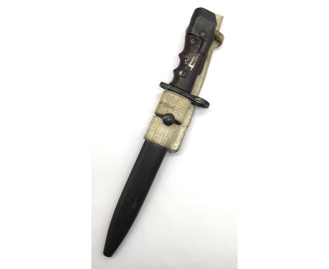 A British knife bayonet No 7 MK1, with scabbard and webbing belt strap. Originally designed for the No 4 and first used on th