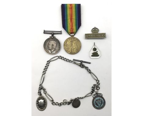 A WW1 underaged casualty medal pair, nickel Imperial Service Badge, and other items. To include: a British War Medal and Vict