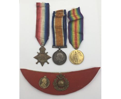 A WW1 1915 Star trio, ribbon bar, and cap badge awarded to PLY 14777 Cpl H.Holmes of the Royal Marine Light Infantry. To incl