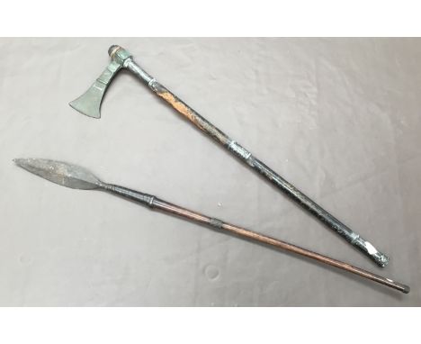 A 19th century Sudanese, Mahdist War era war axe. Comprising of a leather covered wooden shaft, with low grade silver mounts,