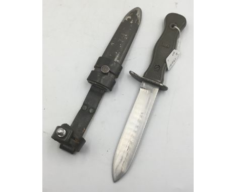 A German Bundeswehr Cold War era M1211 combat knife. With contoured and textured handle, fixed with 2 rivets, with one having