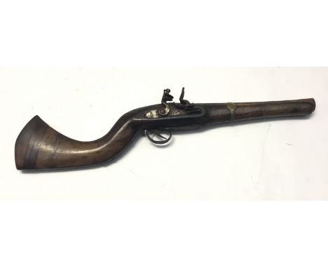 An Antique Indian style flintlock short gun with flared iron barrel 25&rdquo; overall 11&frac12;&rdquo; barrel. Round barrel 
