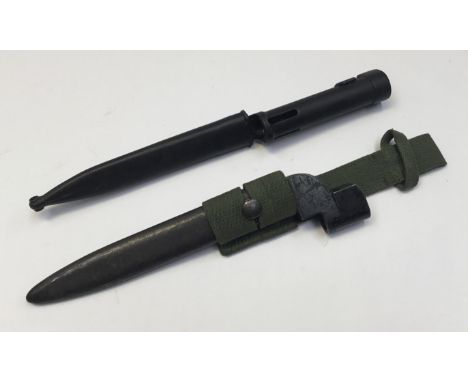 A South African R1 bayonet, with steel mounted nylon scabbard. Of tubular from, and marked with a letter M inside a U, indica