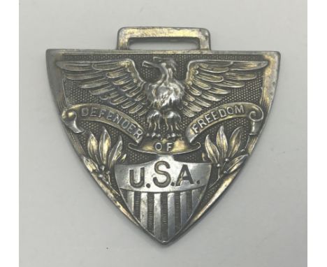 An unusual and likely scarce WW1 era white metal medal or medallion, seemingly some kind of good luck charm for the United St