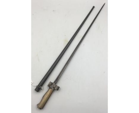 A French WW1 era M1886/16 bayonet and scabbard. Of usual form, having its hooked quillon removed. Featuring a plain brass gri