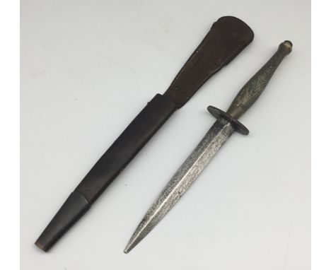 A WW2 era Fairbairn Sykes 2nd Pattern ‘B2’ Commando Knife.Featuring the usual chequered or ‘crosshatched’ brass grip, oval st