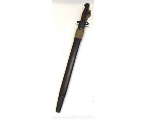 A British WW1 1907 pattern Wilkinson bayonet, complete with scabbard and later webbing frog. Usual wooden slab grips, with wh