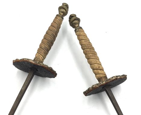A 19th century pair of German made Solingen fencing foils. Each with square section blades, and safety blunted ends. Flat cas