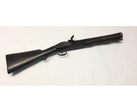 An Antique brass barrelled flintlock &ldquo;blunderbuss&rdquo;. Length overall 26&rdquo; barrel 13 &frac12;&rdquo; bore at mu