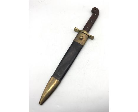 A 20th century reproduction of the very rare 1849 Ames Manufacturing Co mounted rifleman’s knife. Dark wood handle with tubul