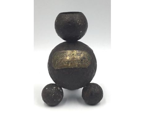 A unusual relic from the Siege of Sebastopol during the Crimean War. Comprising of several small cannonballs or shot that hav