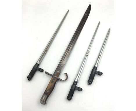 A trio of Chinese type 56 SKS bayonets. Each with cruciform blades, and squared off screwdriver type points to the tips. Desi