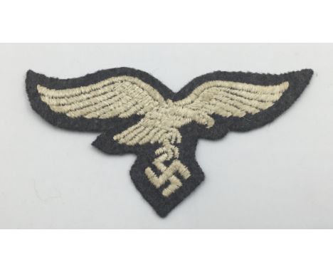 WW2 era German Luftwaffe machine embroidered cloth breast eagle. Usual design, featuring an eagle in flight, clutching a swas