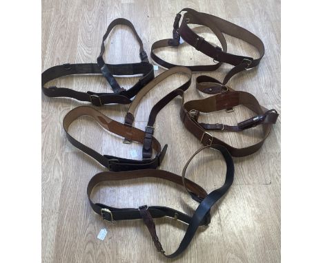 A selection of 5 vintage leather Sam Browne belts with cross straps. Manufactured in mid to dark brown leather, with most exa
