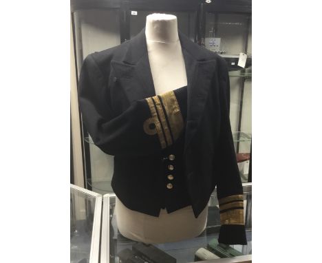 A vintage Royal Navy Vice Admiral’s mess tunic, with a tailors label for C.H.Bernard & Son of Harwich stitched to the inside 