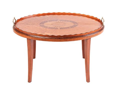 A 19th-century oval West Indian satinwood two-handled gallery tray table, the quartered top with central oval fan and feather