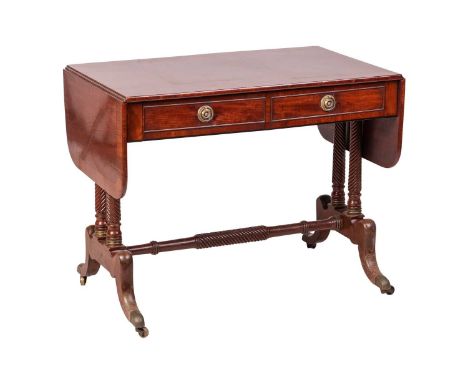 A George IV mahogany two-flap sofa table with ebony strung and crossbanded top fitted with two real and two faux drawers frie