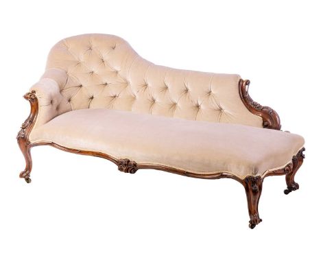 A Victorian serpent-backed rosewood chaise longue, with button back and carved and moulded show frame, on short cabriole supp