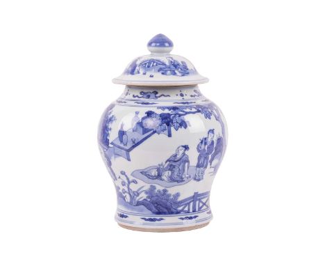 A large Chinese 18th-century style blue and white porcelain baluster vase and cover, 20th century, painted with a scholar in 