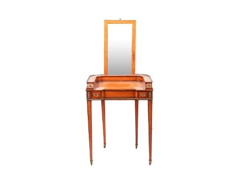 An early 19th-century figured satinwood bonheur du jour of inverted breakfront form, the "D" shaped back with a pierced gilt 