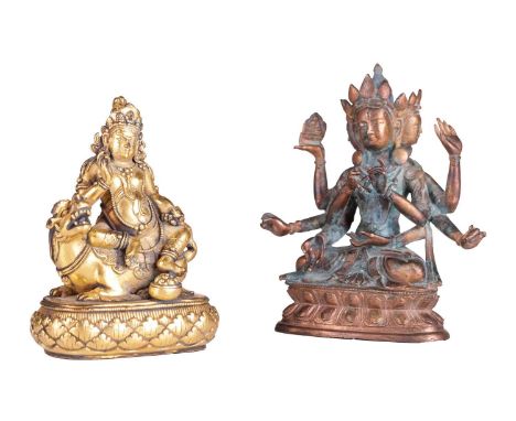 A Sino-Tibetan gilt bronze figure of Vaisravana seated in Vitarka mudra on the back of a snow lion with his companion Nakula 