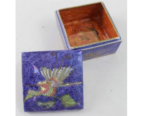 A Wedgwood lustre lidded trinket box of square form decorated with birds in landscape scenes, printed marks and numbered Z529