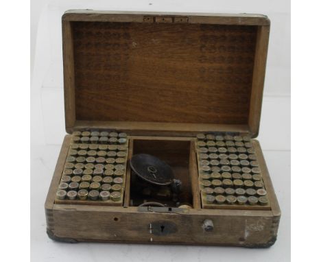 A box containing a collection of B Stahl bullet casing and tools.