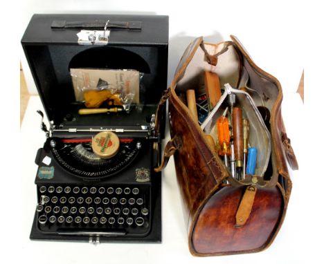 A cased Imperial typewriter and a leather bag containing various tools.