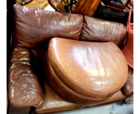 A brown leather two-seat sofa with matching demilune foot rest (2).