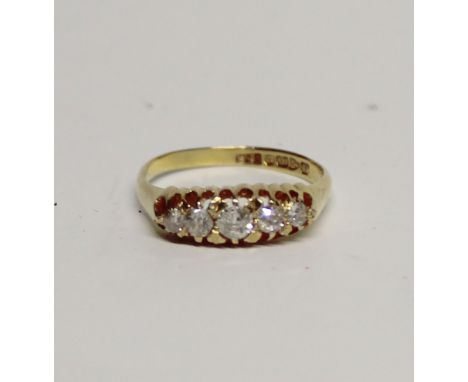 An 18ct yellow gold five-stone diamond ring, approx 50 pints, size R, approx 4g.