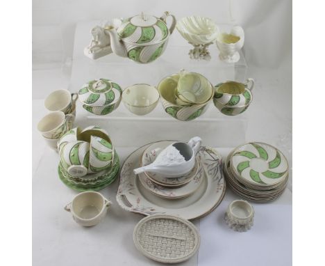 A selection of decorative Belleek to include open salt in the form of a mythical beast, half horse, half sea creature, blue m
