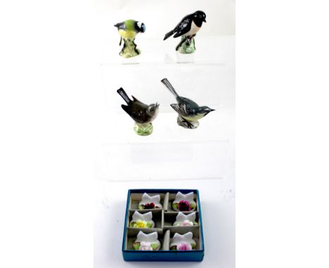 A boxed set of six Coalport porcelain floral table card holders and four Beswick birds including 1041 'Grey Wagtail' and 2274